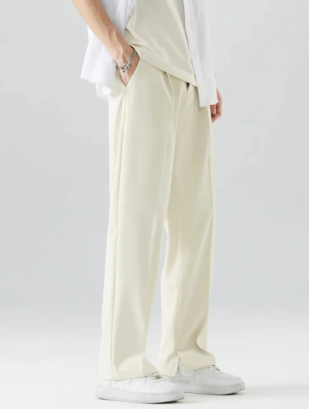 PANTALONI A GAMBA DRITTA CON DRAPPEGGIO AMPIO