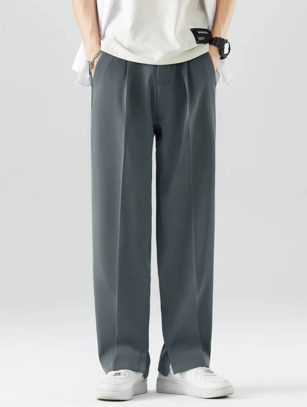 PANTALONI A GAMBA DRITTA CON DRAPPEGGIO AMPIO